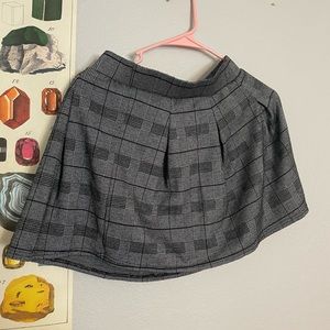 Pleated plaid mini skirt